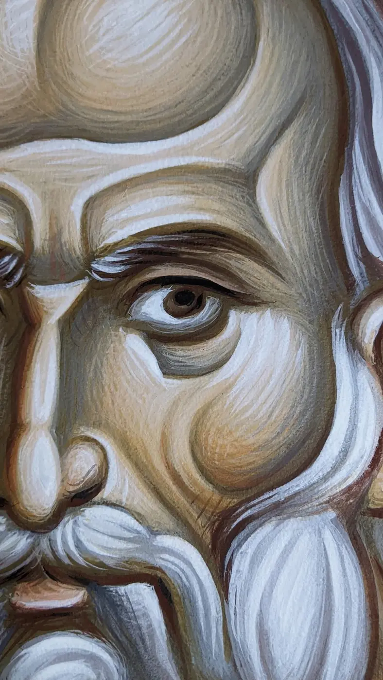 Close detail of brushwork in a painted face, with eye, nose and white beard